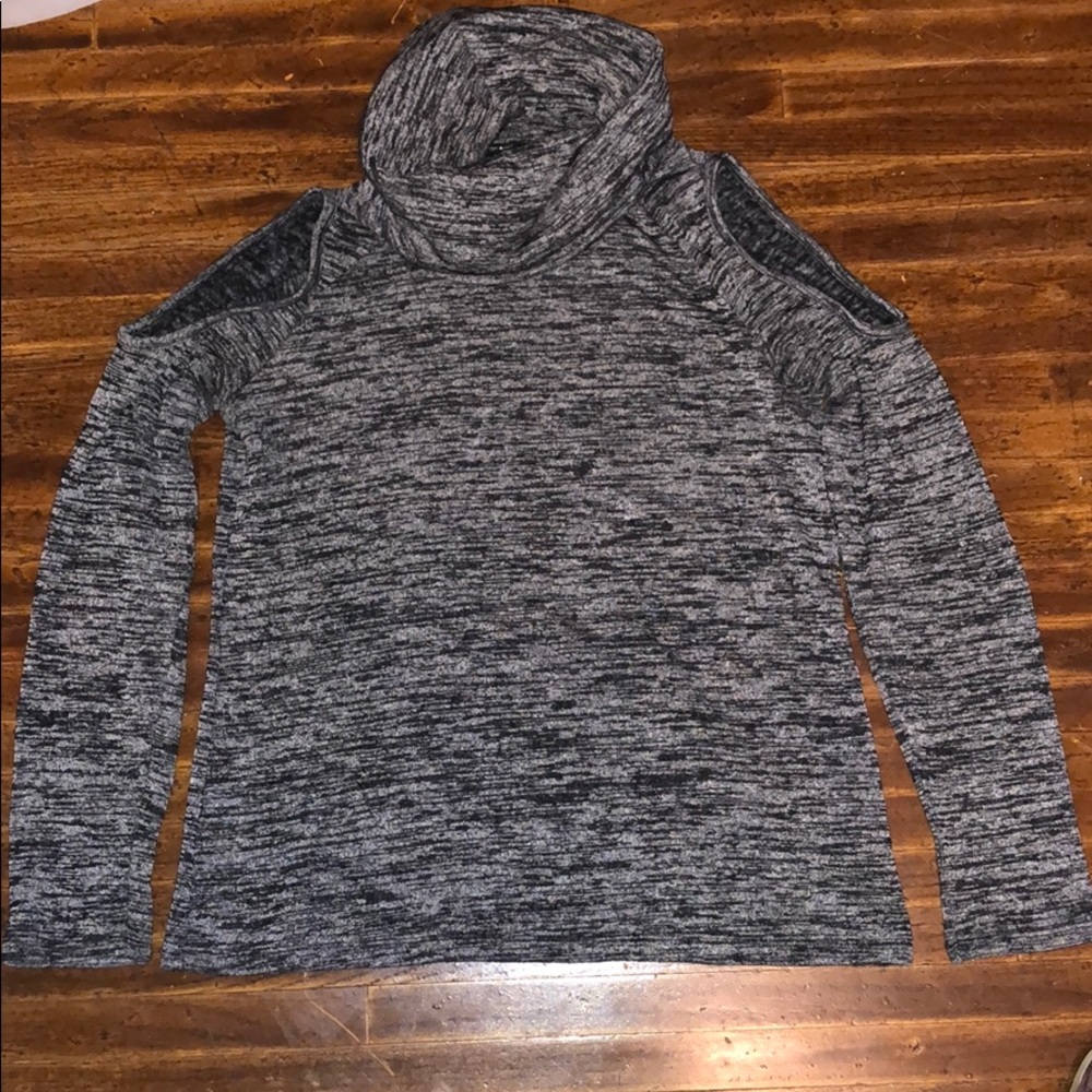 Turtleneck sweater with open shoulders